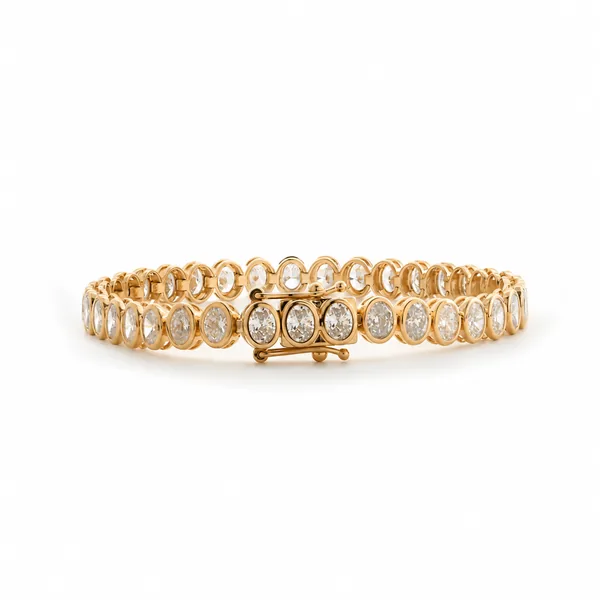 Yellow gold bracelet with a row of round clear stones and a clasp.