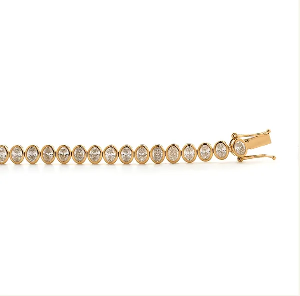 Yellow-gold bracelet with a row of round stones and a visible clasp.