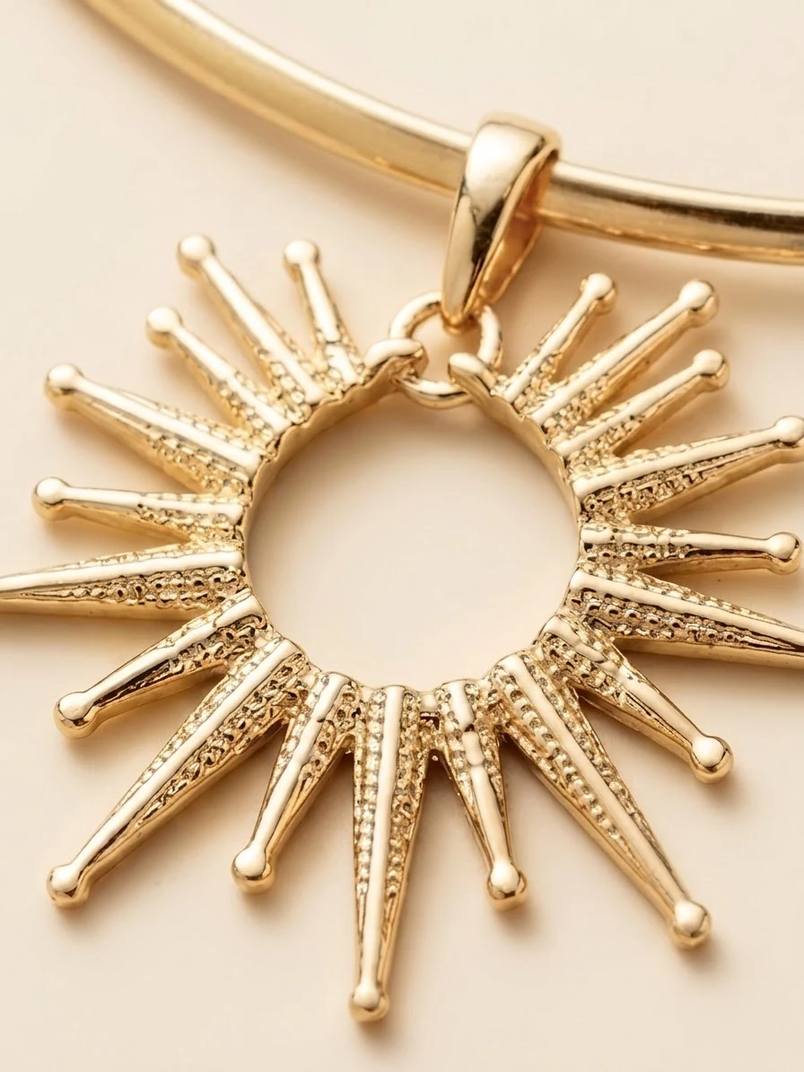 Close view of the sunburst rays and hanging loop